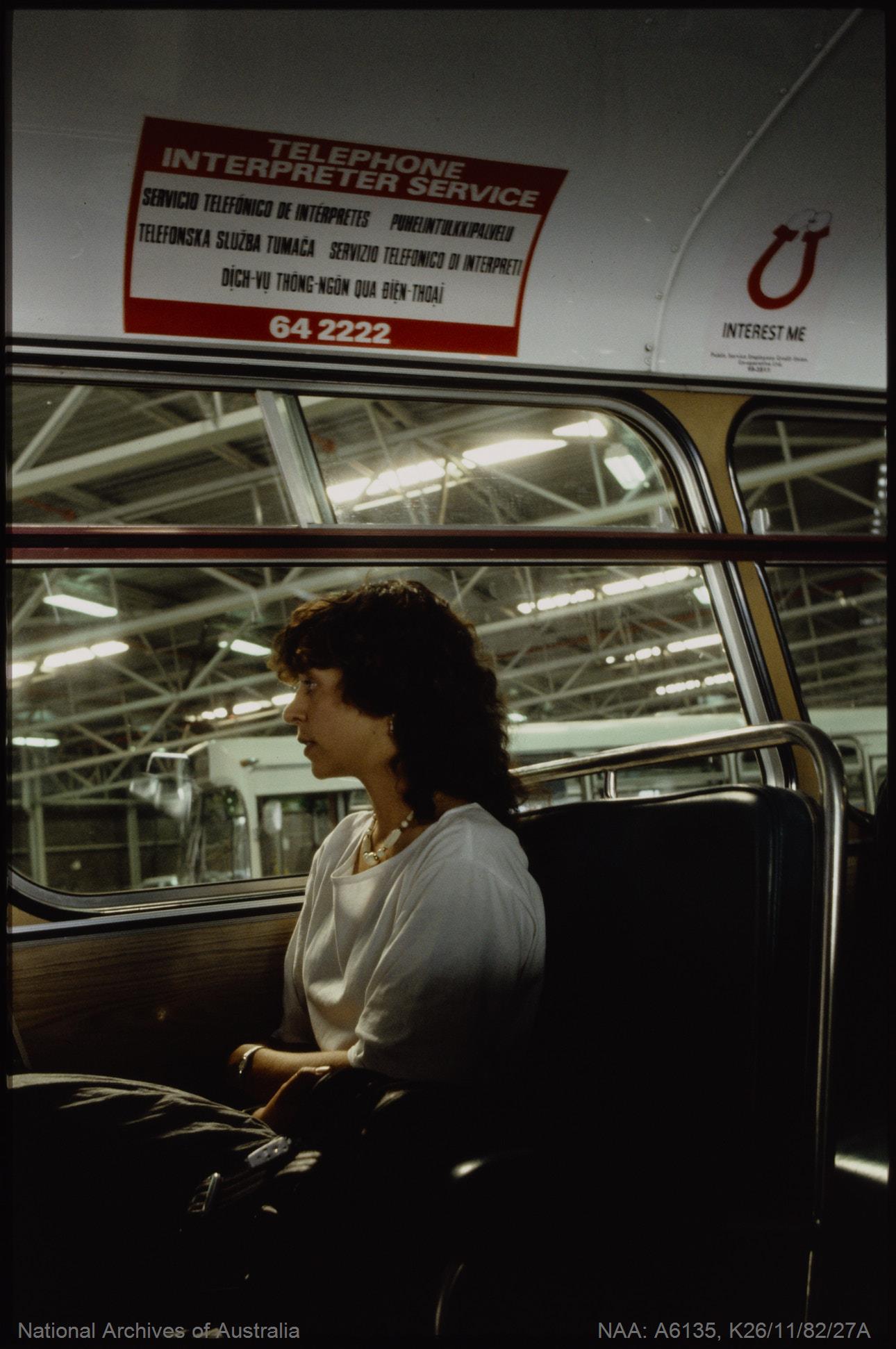 TITLE: Immigration - Sign advertising telephone interpreter service on a Canberra bus