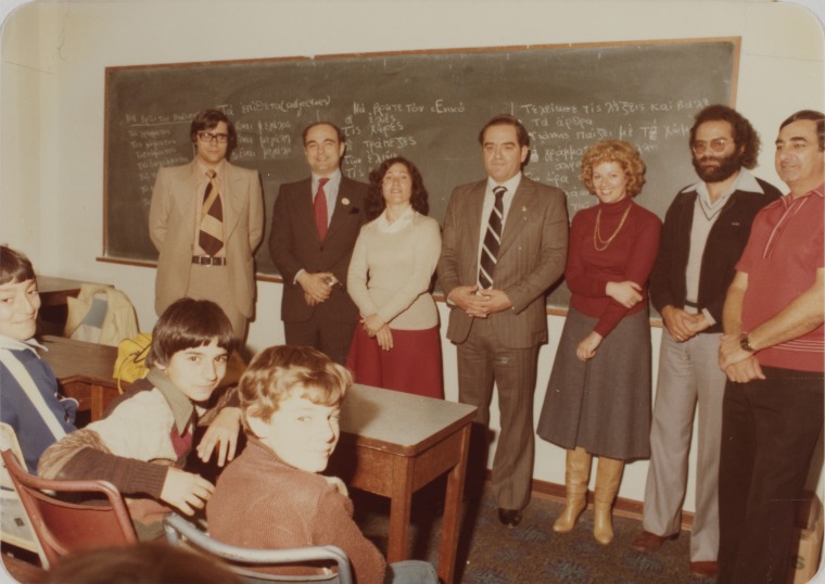 The Greek Consul (centre) with teachers at the Greek school held after hours at the Hellenic Community Centre